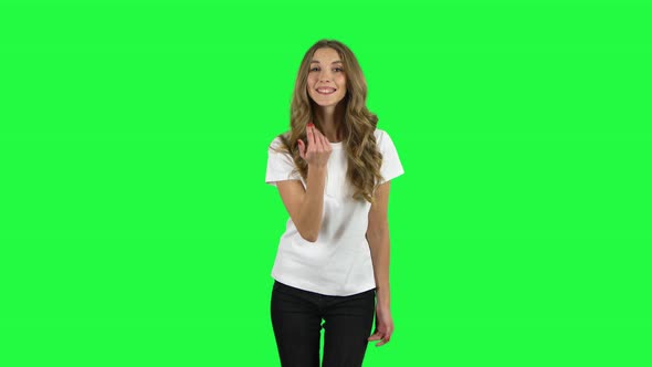 Lovable Girl Waving Hand and Showing Gesture Come Here. Green Screen