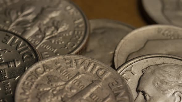 Rotating stock footage shot of American dimes (coin - $0.10)