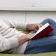 Man sitting on sofa reading book - VideoHive Item for Sale