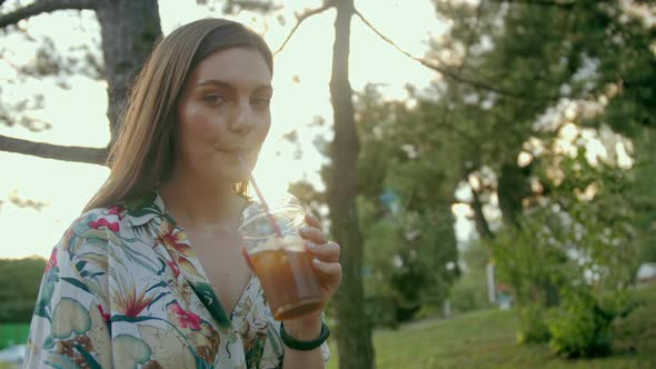 The Girl Drinking Lemonade In Park