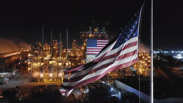 Modern American Petroleum Refinery During Its Work at Night. American Flag at the Foreground. alt