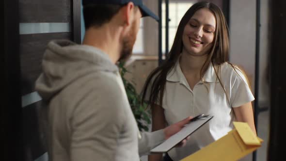 Delivery, Mail, People and Shipping Concept - Happy Man Delivering Parcel Boxes To Customer Home