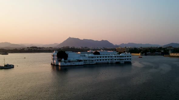 Lake Pichola, Taj lake palace sunset aerial shot in Udaipur, Rajasthan, India