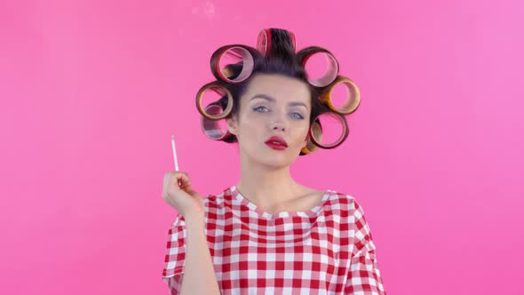 Woman in Hair Rollers Smoking Cigarette