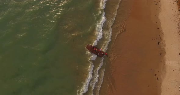 Aerial view of fishmongers in Jangadas, small traditional boats on the beach.