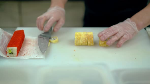 Cook Chops and Serves Japanese Rolls Wrapped in an Omelette