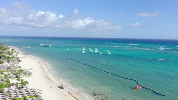Aerial view of sandy beach with turquoise water in paradise - Beautiful sunny day on shore of luxury