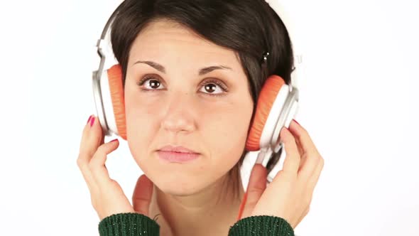 Sad Young Woman Listening Music with Headphones