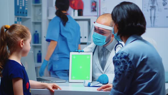 Doctor Using Green Screen Tablet