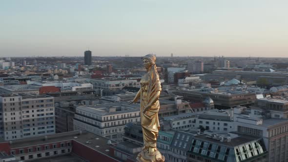 AERIAL: Golden Statue, Sculpture Close Up on Church Cathedral Rooftop in Berlin, Germany, Europe at