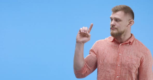 Young Man Pointing with Finger