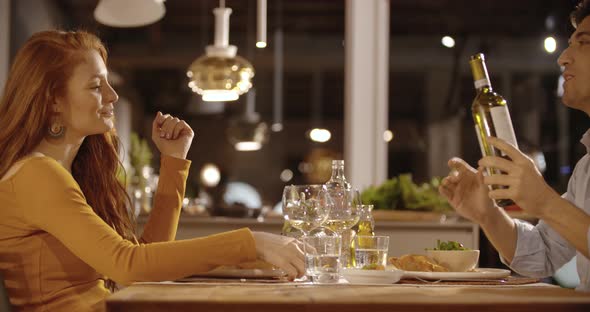 Couple Chat Having Dinner at Home in the Evening