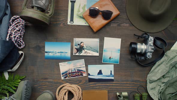 Flat Lay Footage of Photos and Travel Accessories