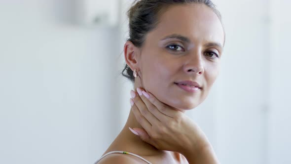 Cheerful Female Touching Neck