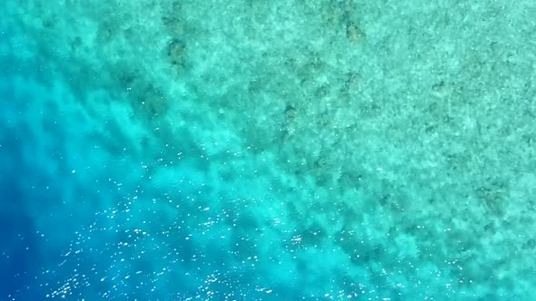 Drone aerial panorama of marine coastline beach voyage by clear sea with sand background