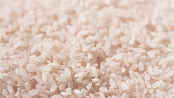 A pile of white rice. Slow Motion.