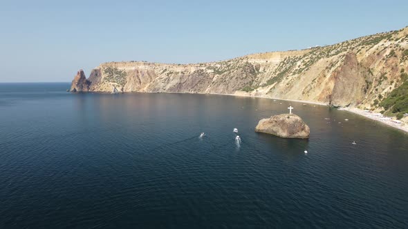 Aerial View From Above on Calm Azure Sea and Volcanic Rocky Shores