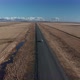 Aerial View of a Moving Car on a Deserted Road in Iceland in Early Spring - VideoHive Item for Sale