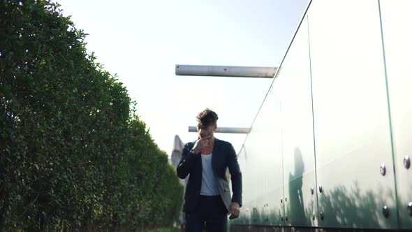 Stylish Man Walking Along the Promenade