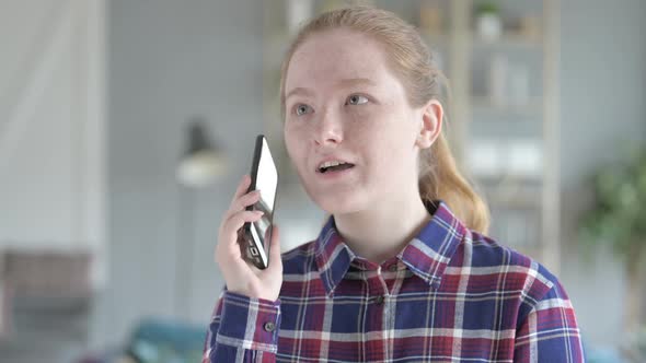 Close Up of Young Woman Speaking on the Phone
