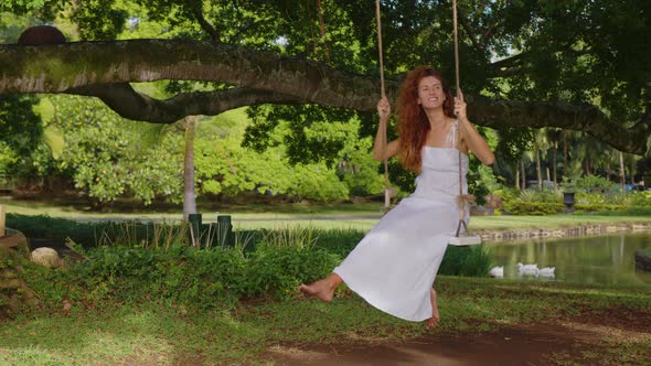 A Childhood Dream of Flying High on a Swing in a Green Forest
