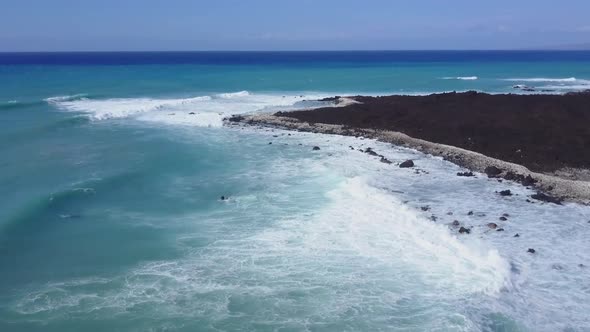 Flying Over The Rugged Coastline Of Hawaii