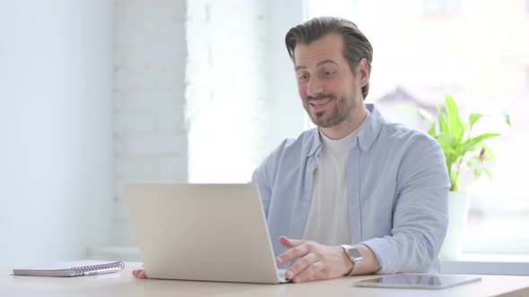 Online Video Call By Young Man in Office