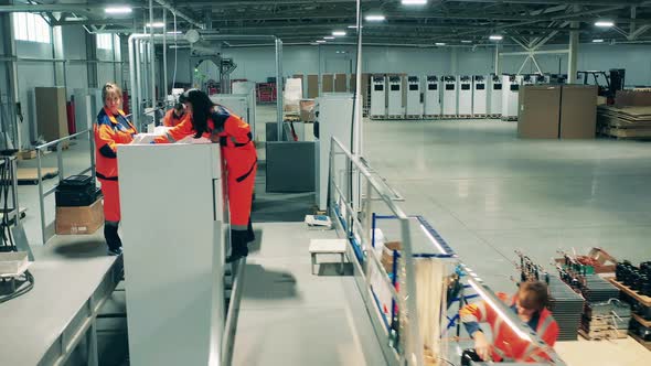 Factory Staff Members Are Fabricating Refrigerators