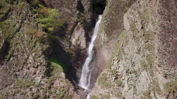 Waterfall between huge rocks