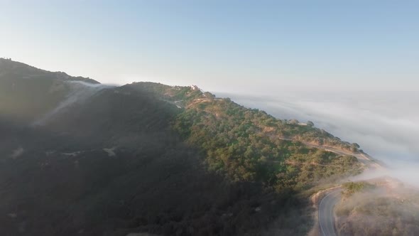 Canyon and the road in the sunshine and clouds below in Malibu Canyon, Monte Nido, California, USA