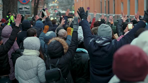 Picketing People on Rally Strike Rise Up Hands to Show Peaceful Unarmed Protest