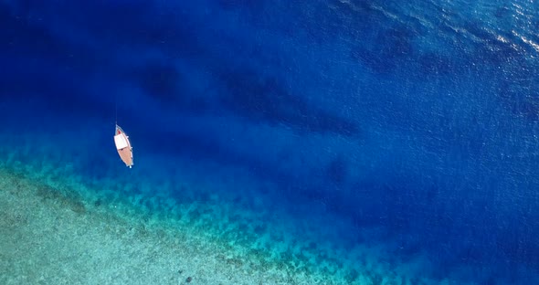 Natural aerial abstract shot of a sunshine white sandy paradise beach and blue ocean background in high res