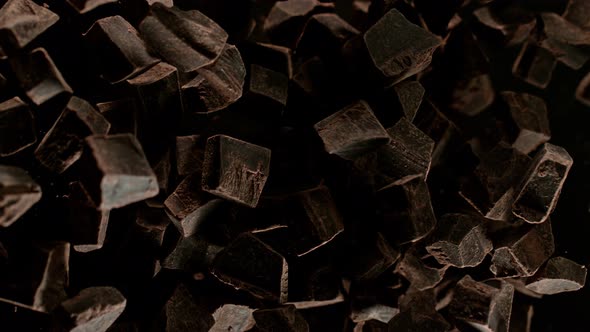 Super Slow Motion Shot of Raw Chocolate Chunks After Being Exploded Towards The Camera at 1000Fps