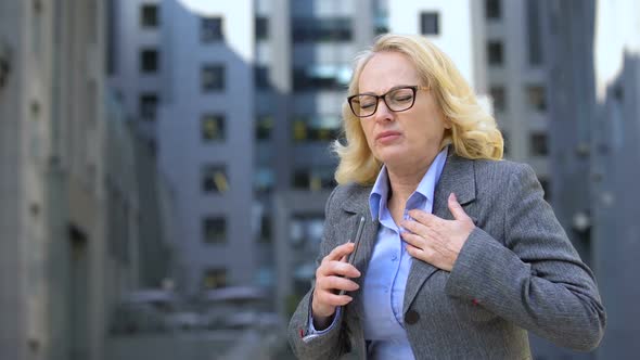 Aged Female Manager Feeling Sudden Chest Pain Talking on Phone, Nervousness