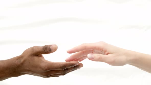 Hands Close Up Multiracial Couple African Man and Caucasian Woman Romantically Touch Each Other