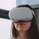 Close up of young woman wearing vr goggles with her hands in the foreground - VideoHive Item for Sale