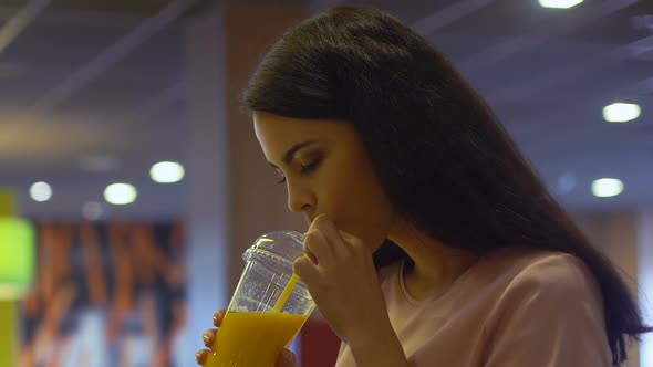 Beautiful Woman Drinking Fresh Juice, Smiling Into Camera, Vitamins and Energy