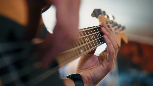 Guitarist Playing On Bass Guitar