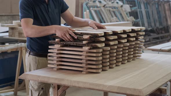 Carpenter Folding Wooden Fence. Showing Ok Sign with Hand Gesture