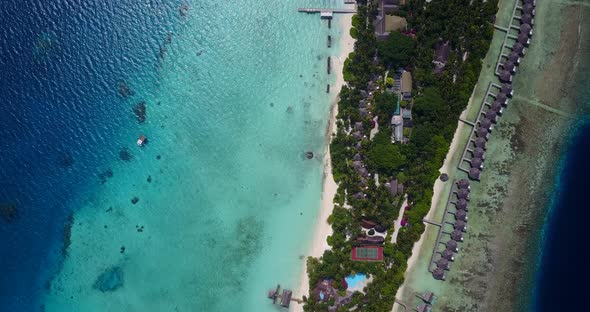 Wide birds eye travel shot of a white sand paradise beach and turquoise sea background in colorful 4