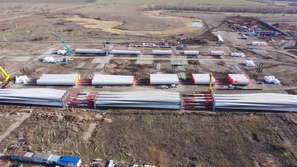 Drone View on the Massive Parts of the Wind Turbines on the Ground, 