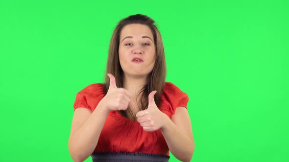 Portrait of Cute Girl Showing Thumbs Up, Gesture Like. Green Screen