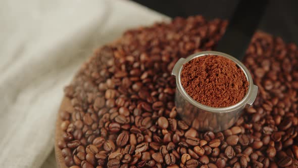 Ground Coffee in Portafilter on Wooden Board with Coffee Beans and Dissipating Steam