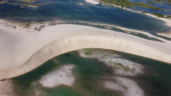 Sand dunes mountains and rain water lagoons at northeast brazilian paradise.