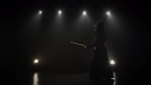 Kendo Master Practicing Martial Art with the Shinai Sword.