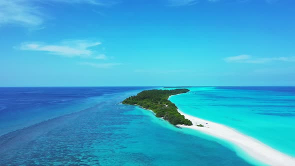 Luxury fly over tourism shot of a paradise sunny white sand beach and aqua turquoise water backgroun