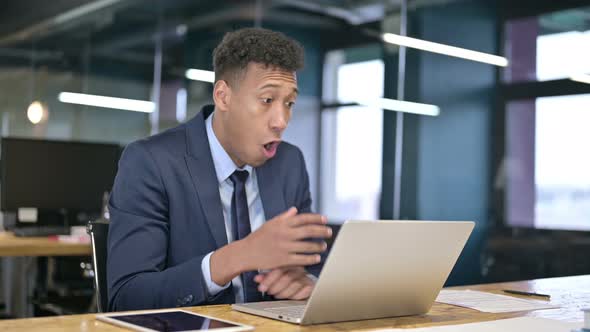 Professional Young Businessman Feeling Shocked in Office 