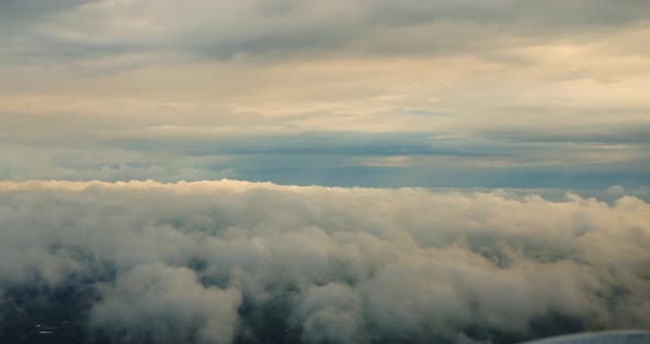 Clouds and Sky View From the Plane Flies High in the Sky Above the Rain Clouds