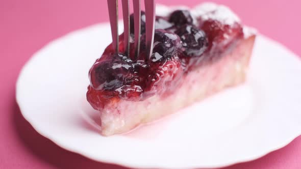 Tasting a Piece of Cake with a Fork Closeup