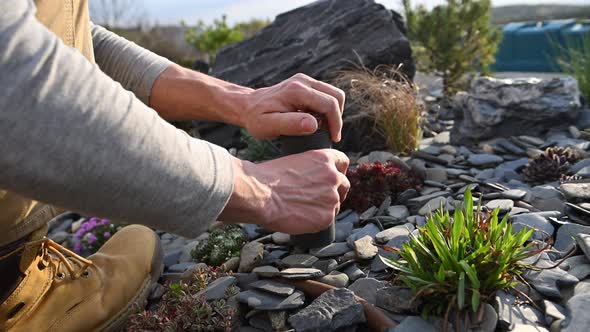 Landscaping Worker Installing LED Garden Outdoor Light